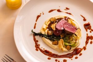 A plate of food on a table, ready to be enjoyed at a cozy Thanksgiving Dinner in Stowe, Vermont.