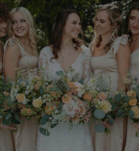 A group of women holding flowers.